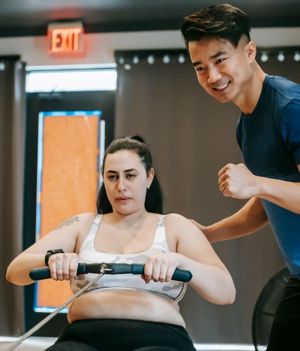 Man performing a functional strength exercise with focus.